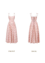 Front view of a pink floral print midi dress with spaghetti straps and a square neckline.