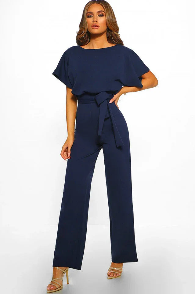 Navy wide leg jumpsuit with tie waist and short sleeves