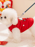 Side profile of a small white dog wearing a red corduroy dog vest with a leash attached.