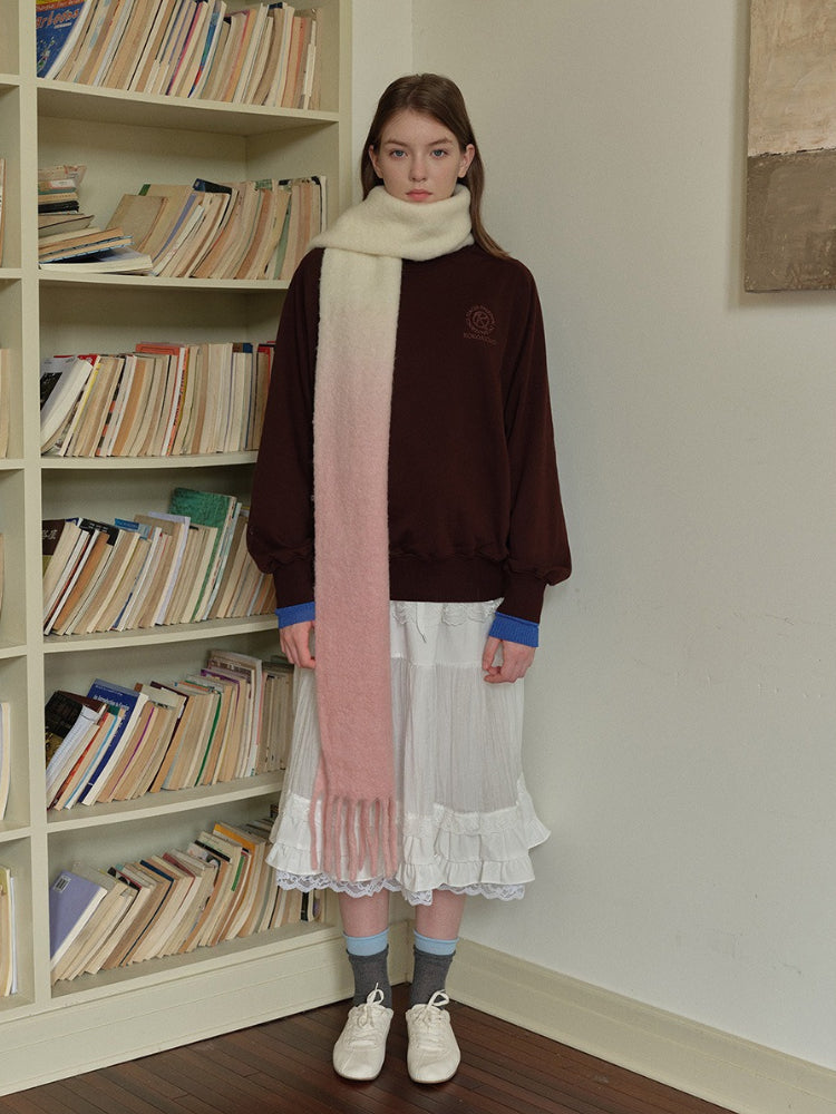 Model in casual attire featuring the ombre gradient scarf.