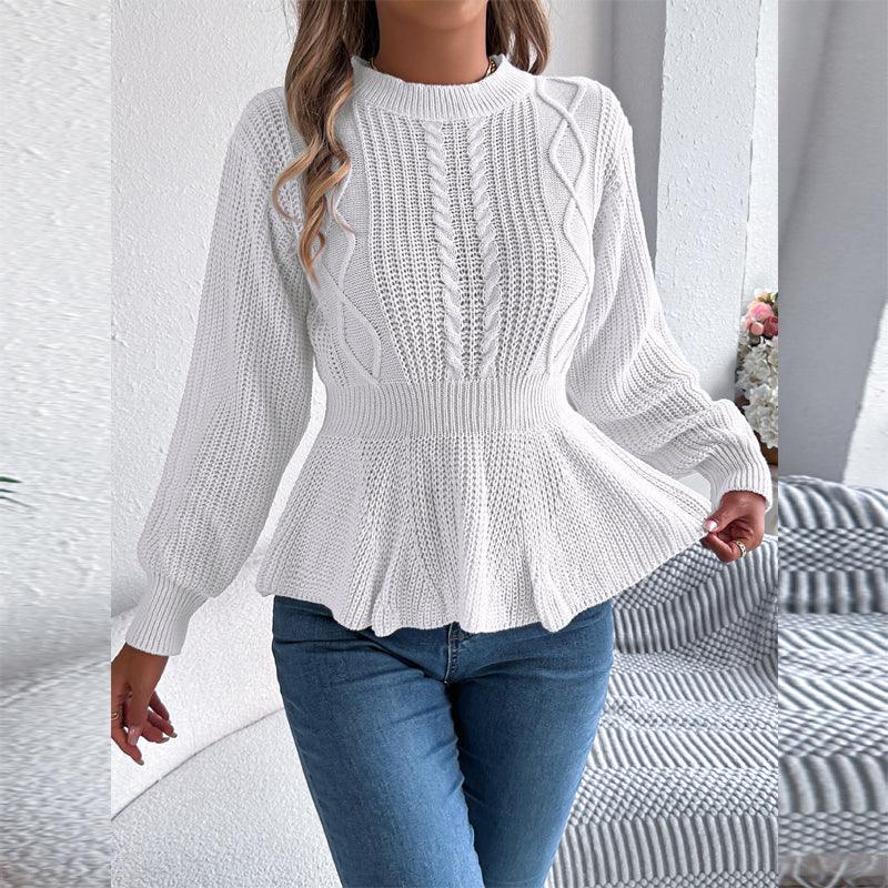 Model showcasing a white peplum sweater with a textured knit and flared hem.