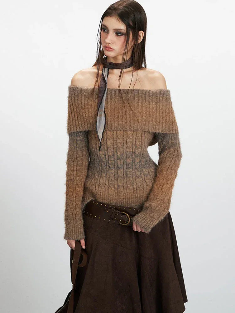 Close-up of a woman wearing a brown and grey gradient off-the-shoulder knit sweater with a scarf.