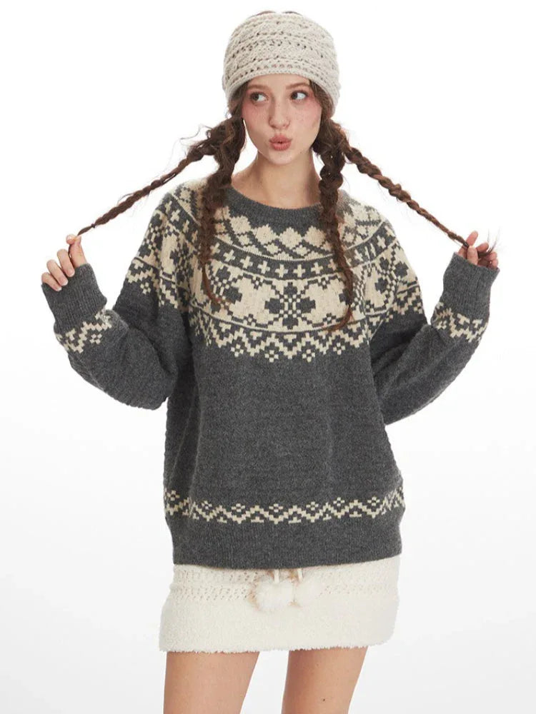 Model posing with a grey Fair Isle crewneck sweater