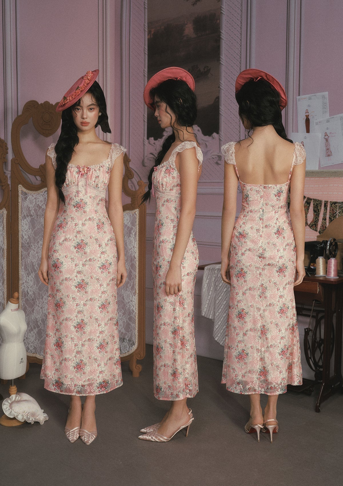 Back view of a pink floral print midi dress with lace trim.