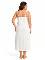Rear view of a woman wearing a white slip dress