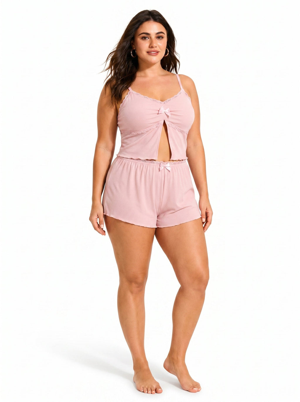Front view of a woman modeling a pink cami and shorts pajama set