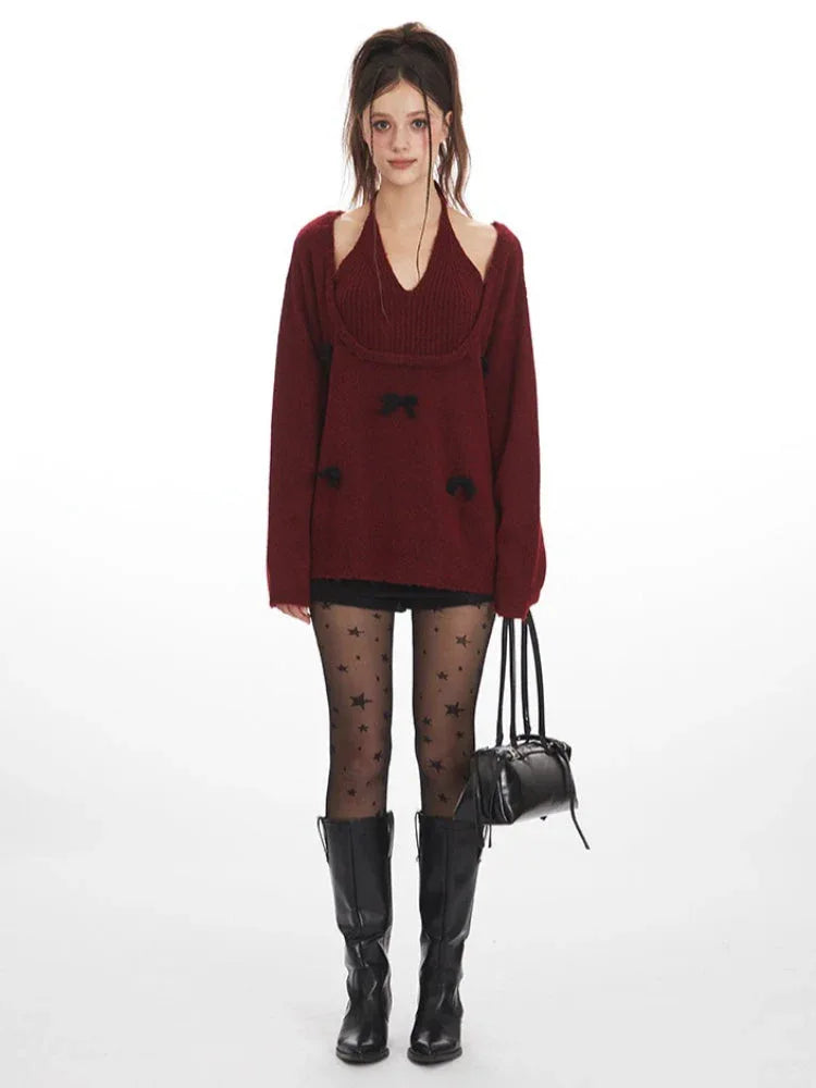 woman wearing a burgundy knit sweater with black bows