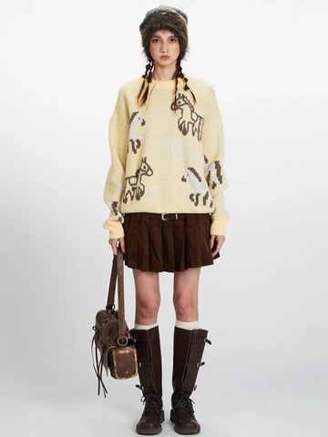 Woman wearing a yellow knit sweater with a horse graphic print, brown pleated skirt, white socks, and brown boots.