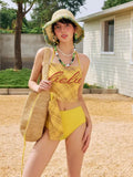 Back view of a yellow plaid bikini set with skirted bottom, showing tie waist detail.