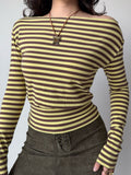 Front view of a woman in a horizontally striped top, highlighting the fabric texture and neckline.