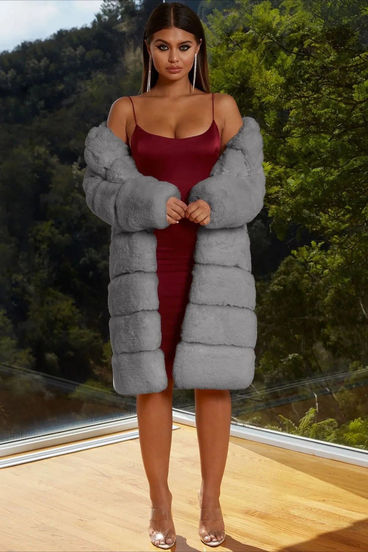 Model in a grey faux fur coat over a satin dress