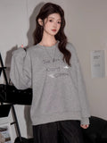 Casual grey sweatshirt featuring a printed design on the chest.