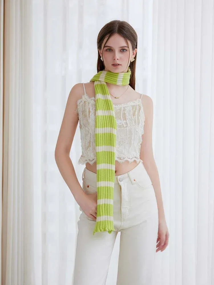 Woman wearing a long black and white striped knit scarf with ruffle edges - View 8 | WEUXS