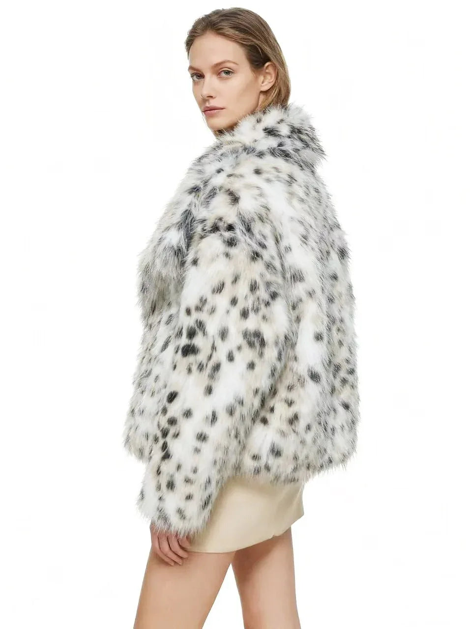 Back view of a woman in a faux fur leopard print cropped jacket
