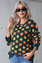 Front view of a woman in a long-sleeved knit sweater with a leaf pattern.