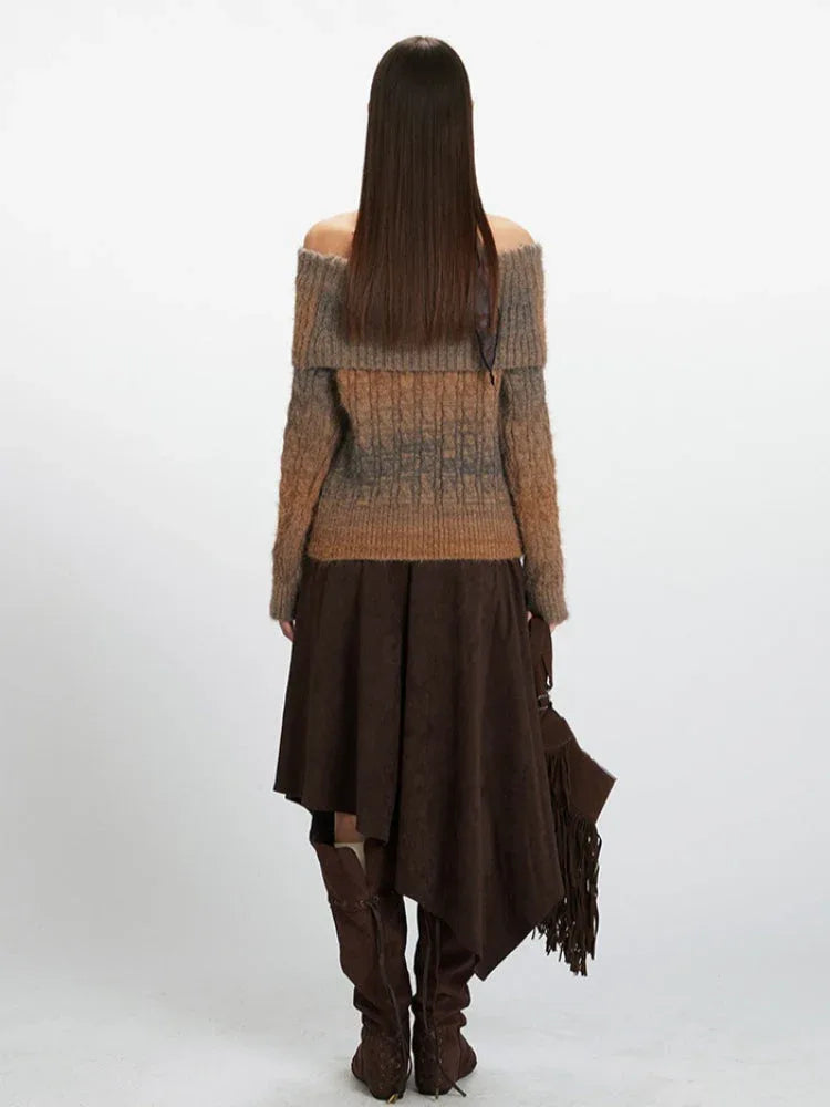 Back view of a woman in a brown and grey gradient off-the-shoulder knit sweater.
