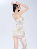 Back view of a woman in a floral print mini dress with lace trim