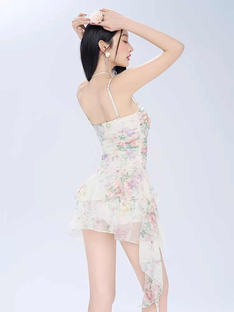 Back view of a woman in a floral print mini dress with lace trim