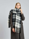 Woman styled with a winter plaid scarf