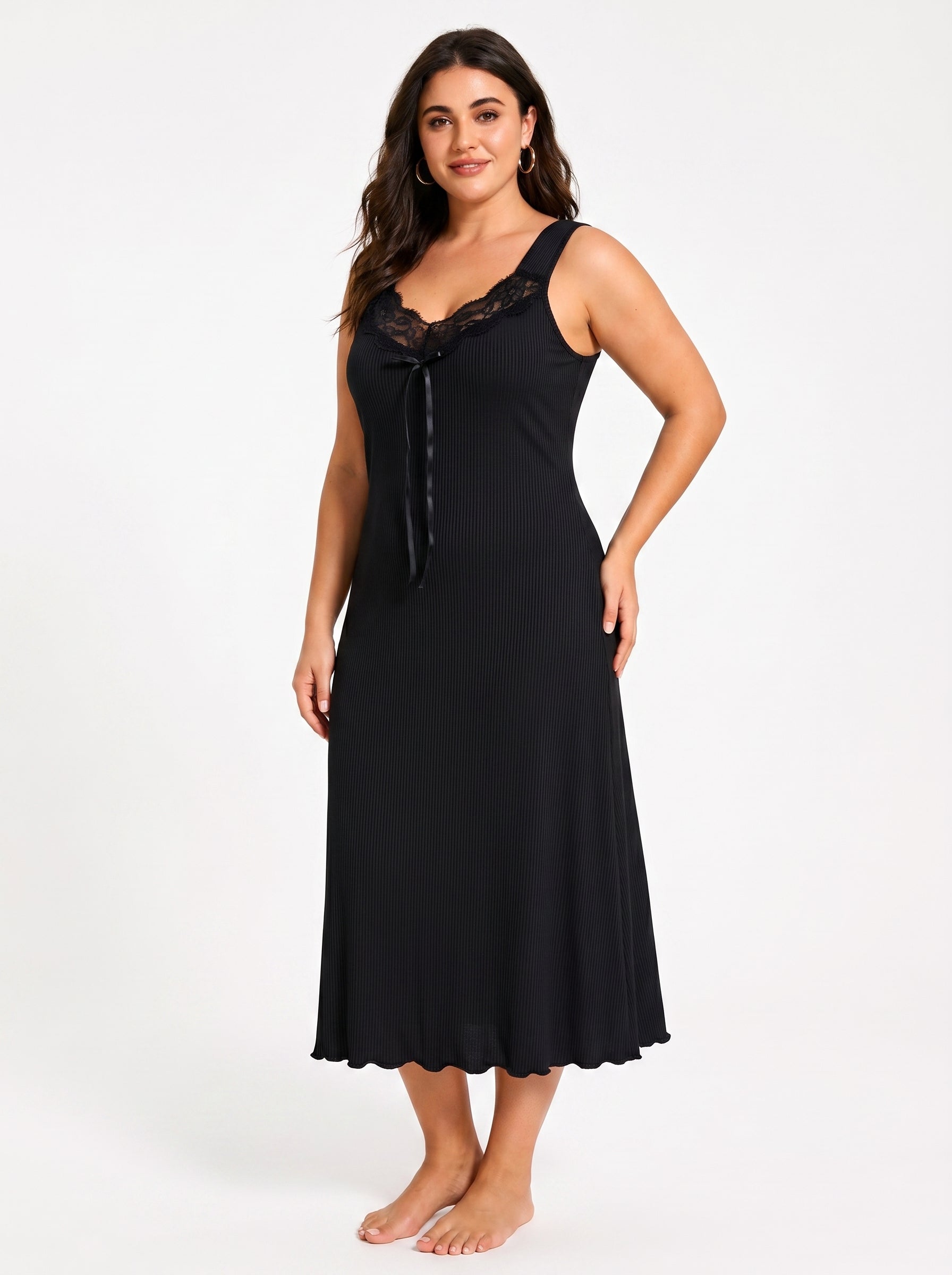 Full-length shot of a woman wearing a black V-neck nightgown