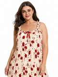 Close-up of the neckline of a cream and red floral print nightgown.