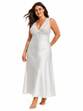 Woman wearing a white satin and lace nightgown, side profile