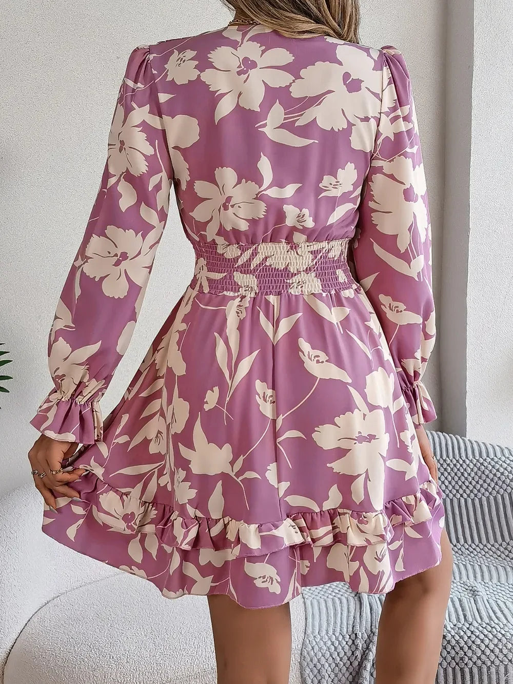 Back view of a mauve purple floral tie-front mini dress