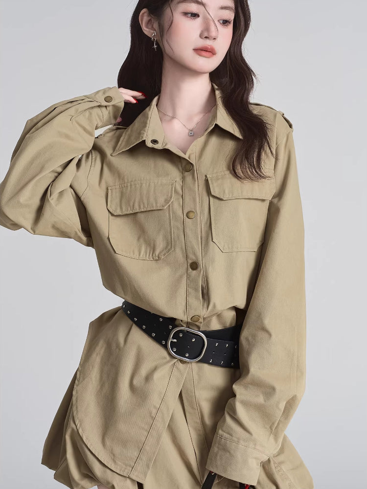 Woman wearing a khaki shirt dress with button-down front and chest pockets.