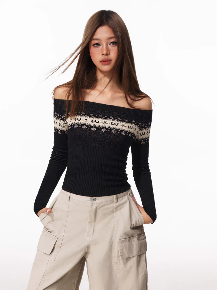 Woman wearing a black off-the-shoulder long-sleeve sweater with a white and black patterned yoke, paired with beige cargo pants.
