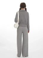 Back view of a woman wearing a grey ribbed knit loungewear set.