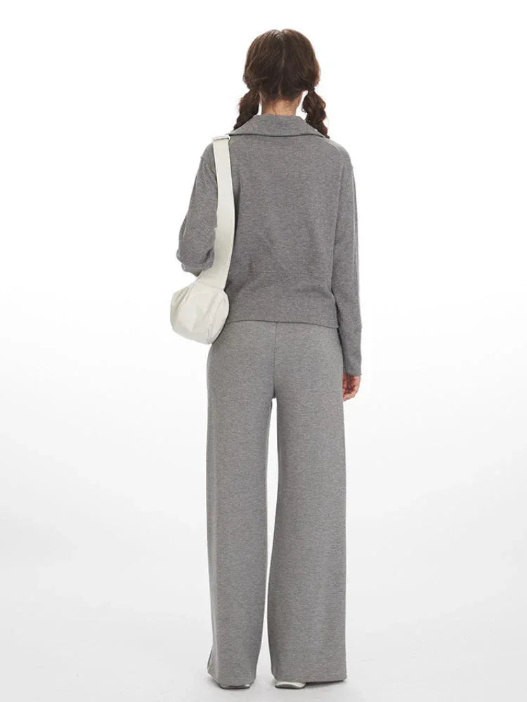 Back view of a woman wearing a grey ribbed knit loungewear set.