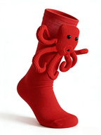 Close-up of red socks featuring a playful octopus design