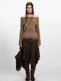 Woman wearing a brown and grey gradient off-the-shoulder knit sweater with long sleeves.