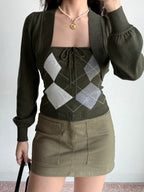 Full outfit view showing the dark green argyle knit set paired with khaki cargo skirt.