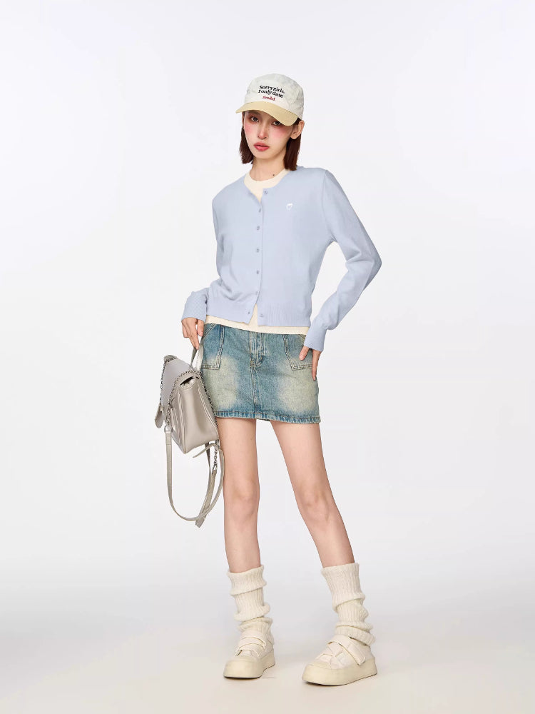 Cropped knit cardigan in a pastel blue hue
