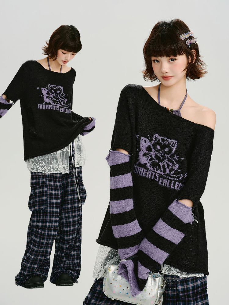 Woman modeling a black knit sweater with purple and black striped sleeves and cutouts.