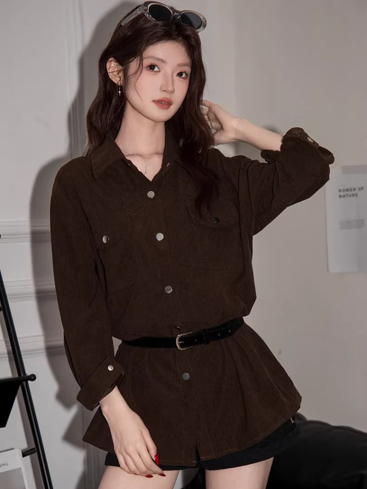Full-body shot of a woman in a brown corduroy oversized shirt, showcasing the silhouette.