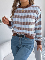 Woman in a casual striped sweater and denim jeans