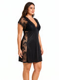 Woman wearing a black lace-trimmed chemise, close-up of the side.