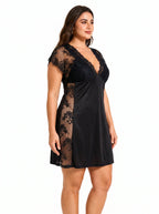 Woman wearing a black lace-trimmed chemise, close-up of the side.