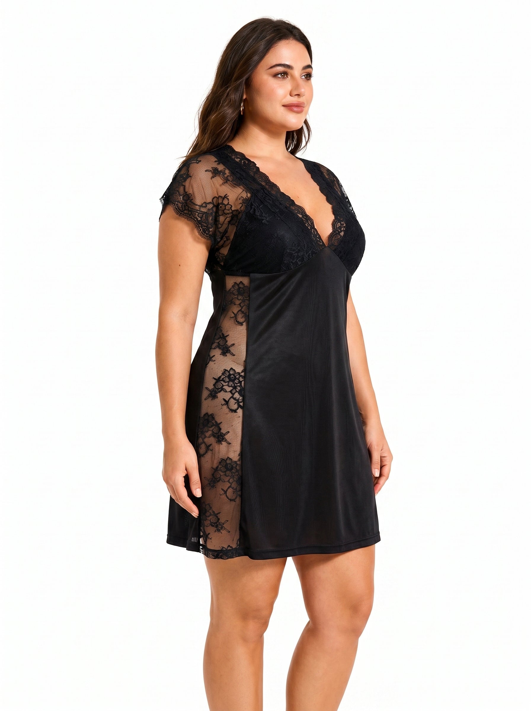 Woman wearing a black lace-trimmed chemise, close-up of the side.