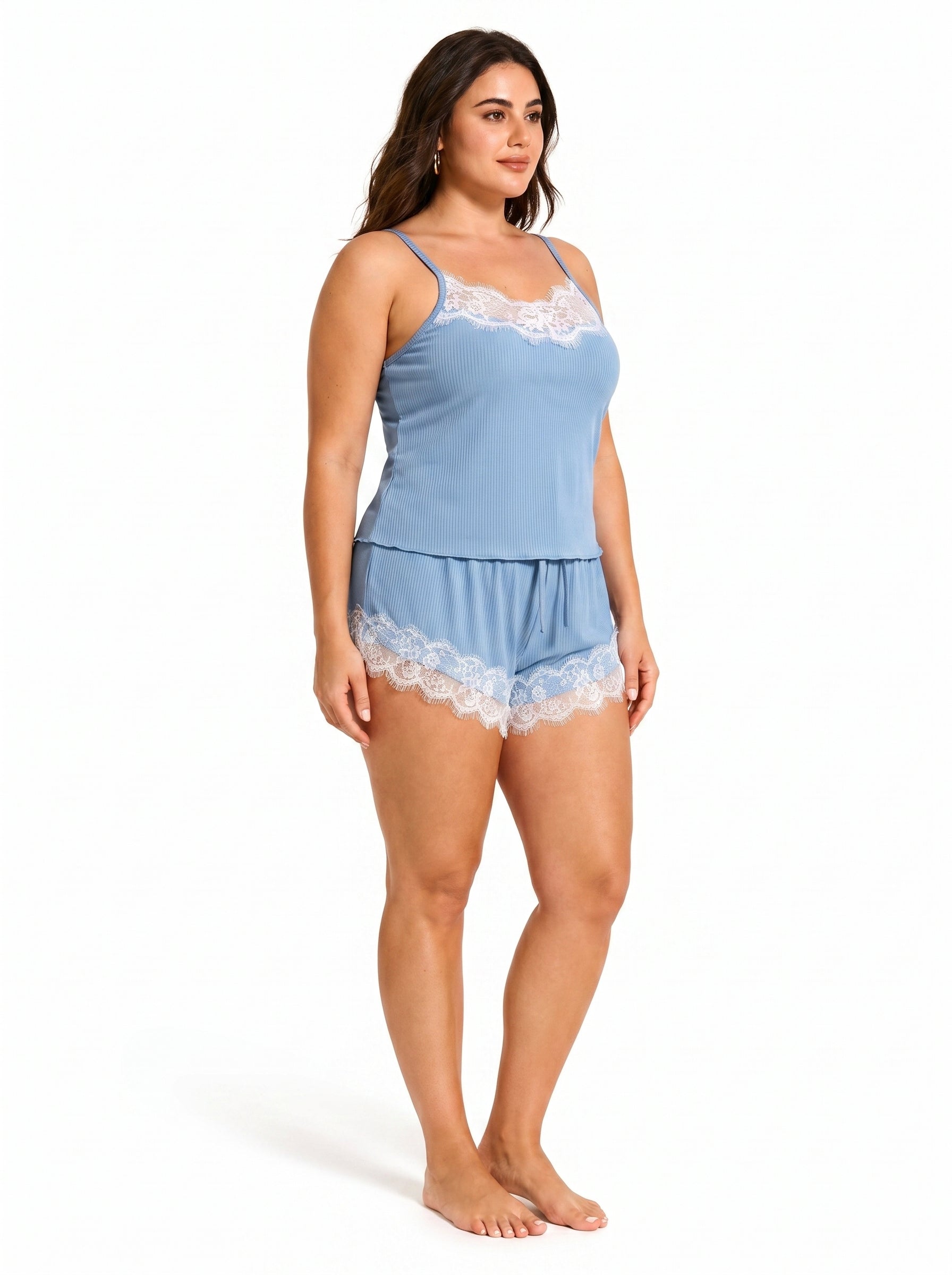 Side view of a woman wearing a light blue ribbed knit camisole and shorts set with white lace trim.