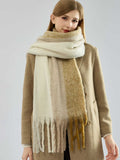Model showcasing a cozy, multi-colored striped scarf with a brushed finish, draped around her neck.