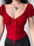 Red velvet top with tie front detail and puffed short sleeves