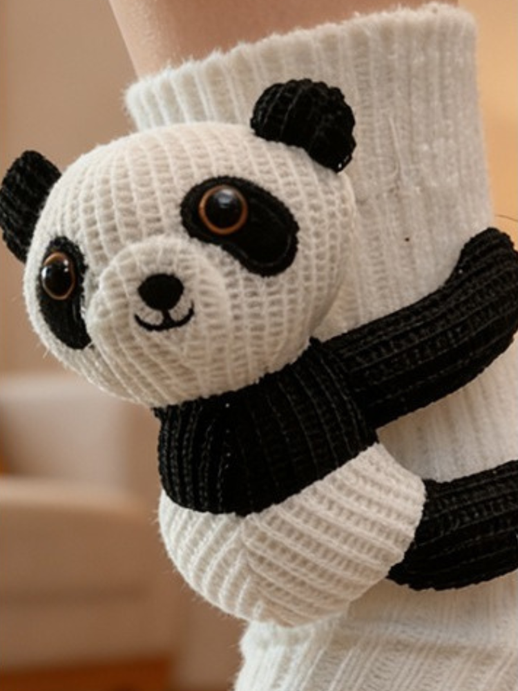 Close-up of the white knit sock with a detailed panda applique