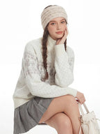 Model showcasing the relaxed fit of a Fair Isle half zip sweater.