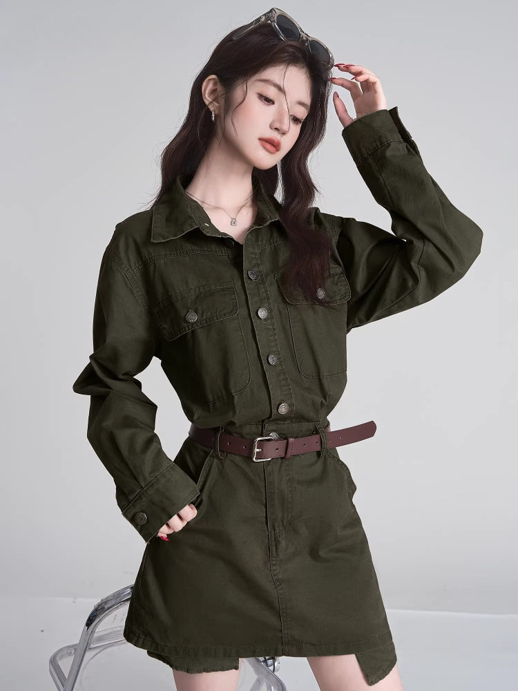 Close-up of a woman in a green collared dress, showcasing the fabric and button details.