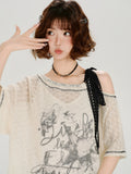 Detail of the lace trim and shoulder tie on the tunic.