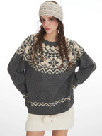 Fashion shot of a woman in a grey Fair Isle crewneck sweater