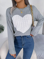 Close-up of the heart graphic on the grey sweater.